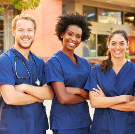 three smiling nurses