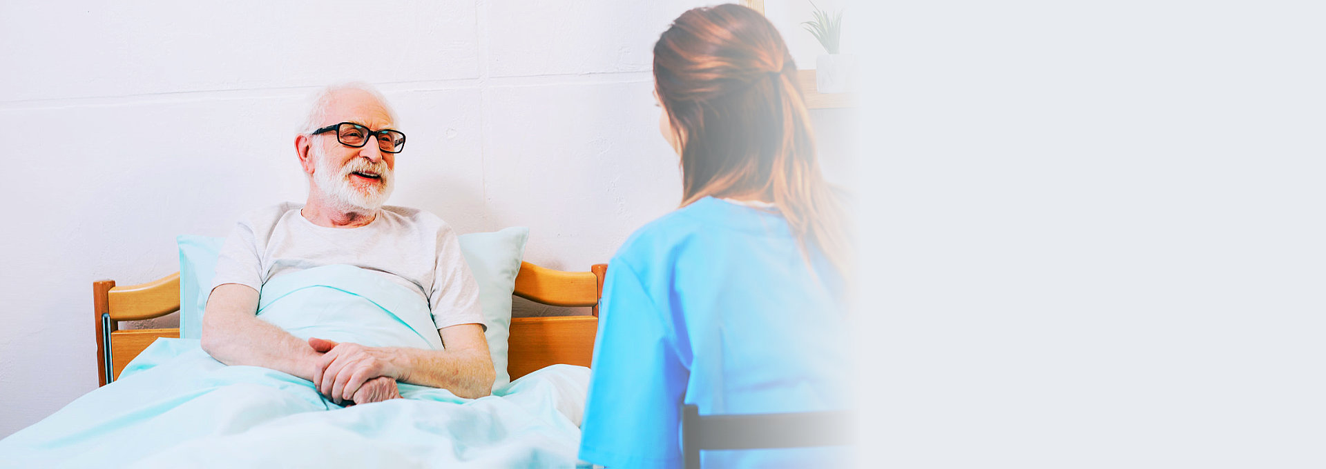 senior man talking to his nurse