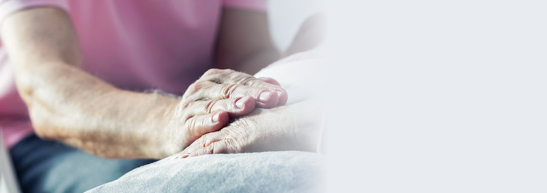 senior man holding the hand of a senior woman