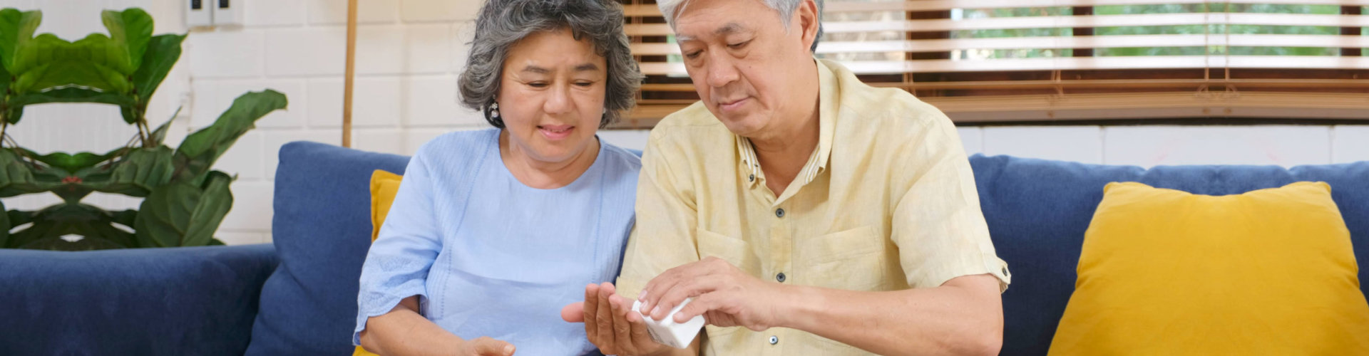 husband giving his wife her medication