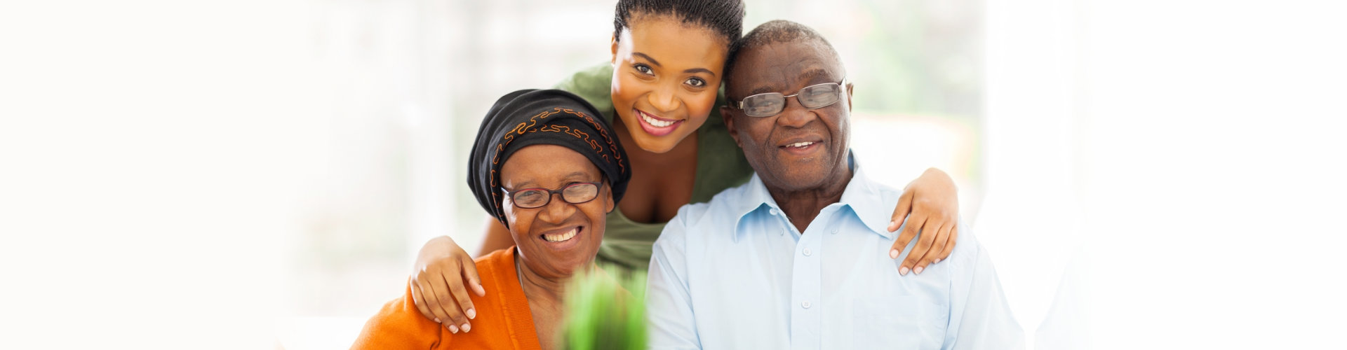 senior couple with their caregiver
