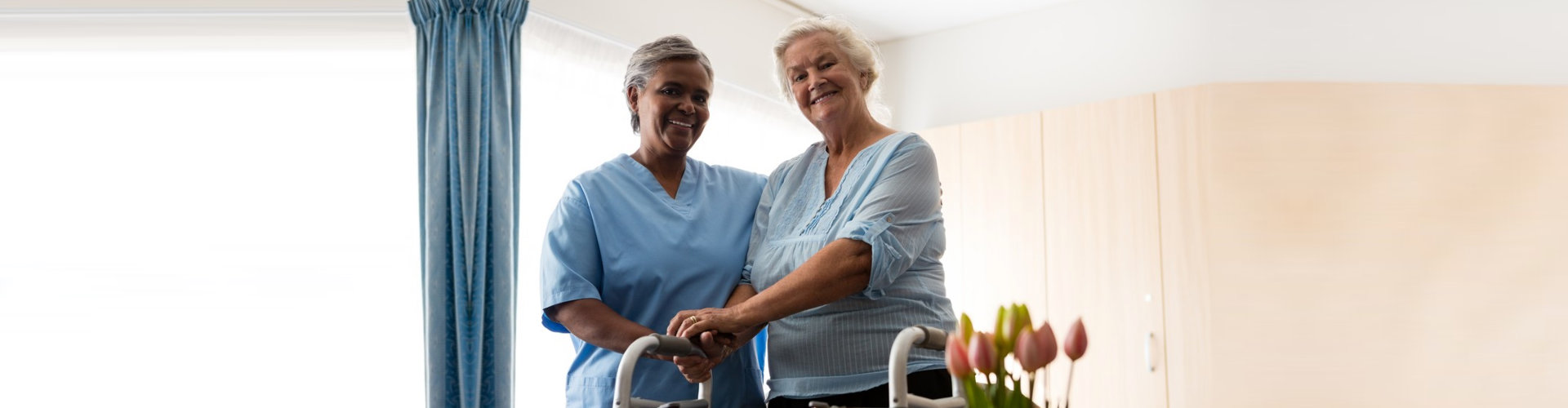 caregiver assisting senior woman